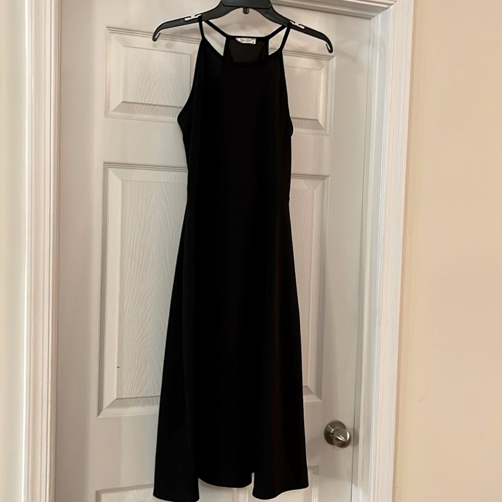 Two sleeveless polyester dresses, size large, red, and white $20 for both